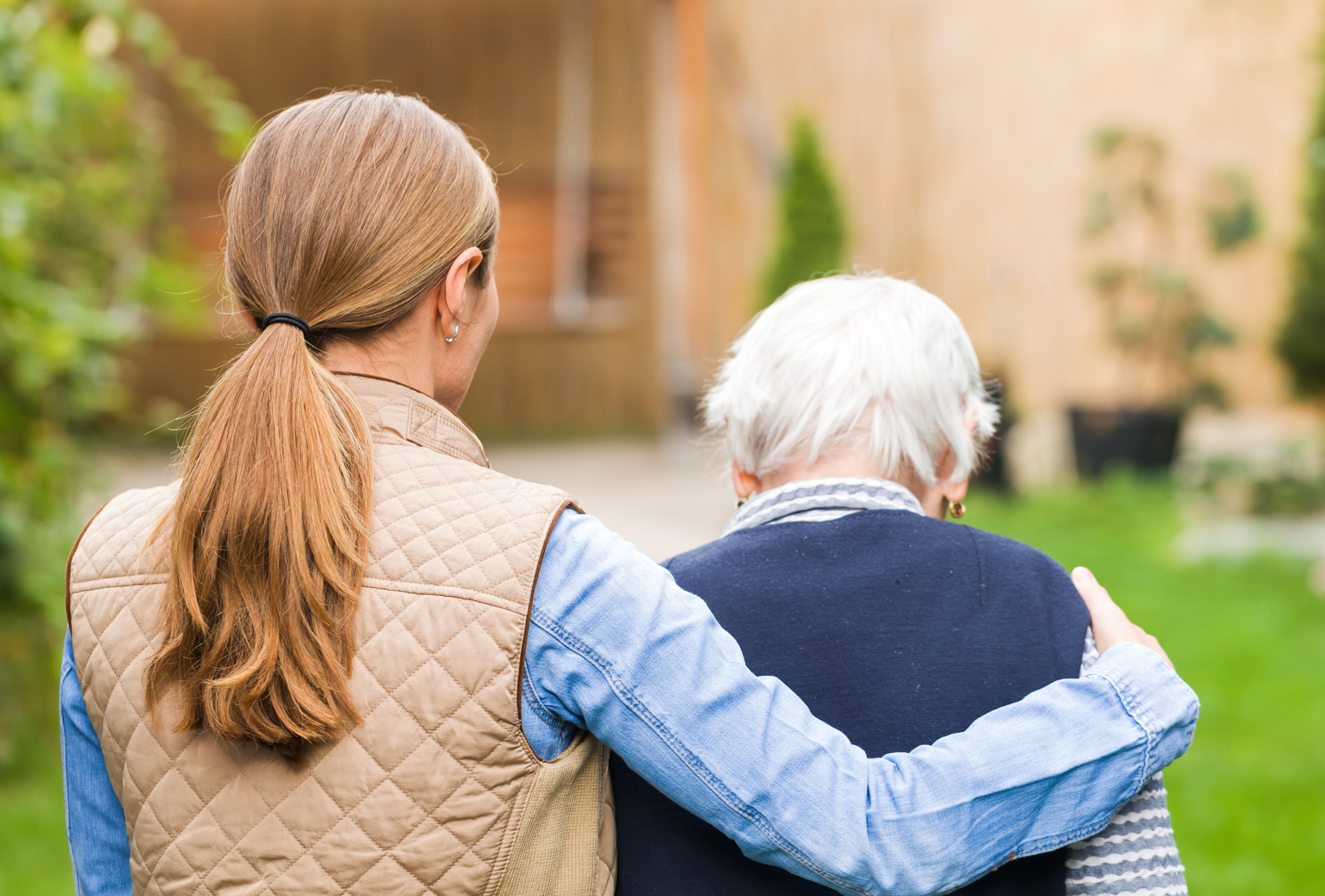 Caregiver Walking with Elderly Dementia Patient