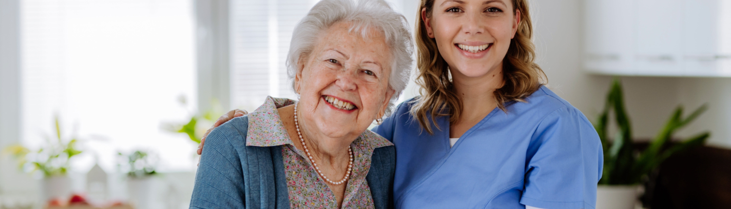 Compassionate, Professional & Reliable In-Home Support Smiling senior woman and caregiver