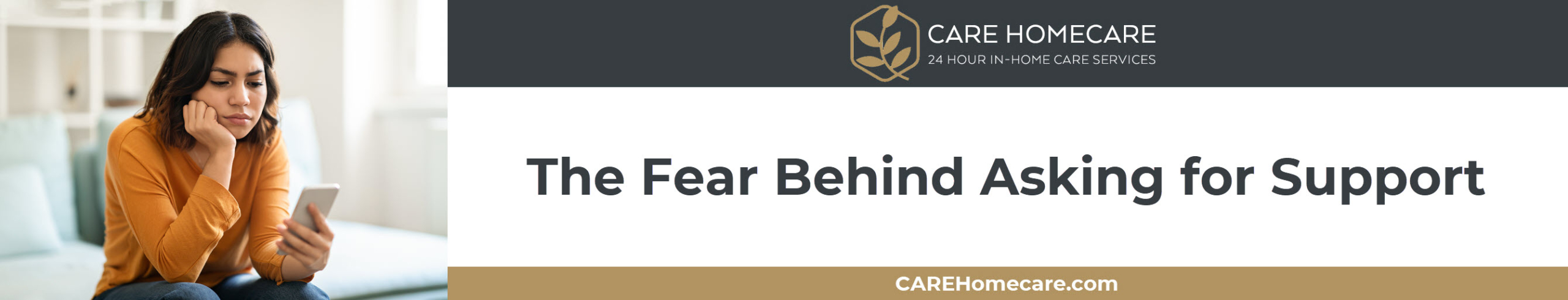 A caregiver hesitating with a phone in hand, unsure whether to reach out for help.